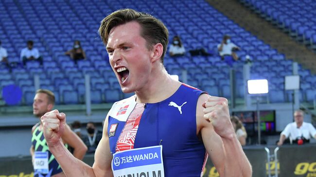 Norway's Karsten Warholm celebrates after wins in the men's 400mt Hurdles final during the IAAF Diamond League competition on September 17, 2020 at the Olympic stadium in Rome. (Photo by Andreas SOLARO / AFP)