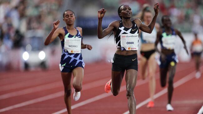 Hellen OBIRI from Kenya (R) and Fantu WORKU from Ethiopia compete in the 5000M women final at the Diamond League track and field meeting in Oslo on July 1, 2021. (Photo by STR / Diamond League AG)