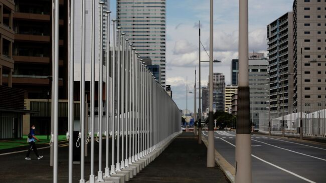 A view shows flag poles at the Tokyo 2020 Olympic and Paralympic Village in Tokyo, Japan, June 20, 2021.   REUTERS/Kim Kyung-Hoon