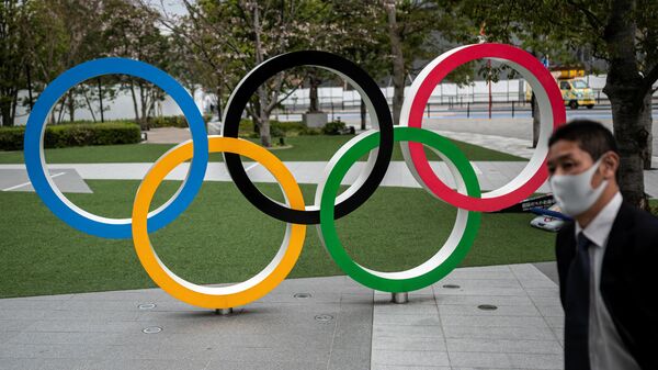 This picture shows the Olympic Rings outside the Japan Olympic Museum in Tokyo on March 22, 2021. (Photo by Charly TRIBALLEAU / AFP)
