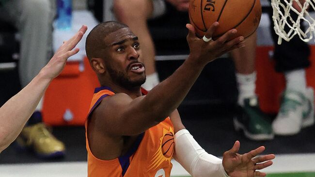 MILWAUKEE, WISCONSIN - JULY 20: Chris Paul #3 of the Phoenix Suns goes up for a shot against the Milwaukee Bucks during the first half in Game Six of the NBA Finals at Fiserv Forum on July 20, 2021 in Milwaukee, Wisconsin. NOTE TO USER: User expressly acknowledges and agrees that, by downloading and or using this photograph, User is consenting to the terms and conditions of the Getty Images License Agreement.   Jonathan Daniel/Getty Images/AFP (Photo by JONATHAN DANIEL / GETTY IMAGES NORTH AMERICA / Getty Images via AFP)