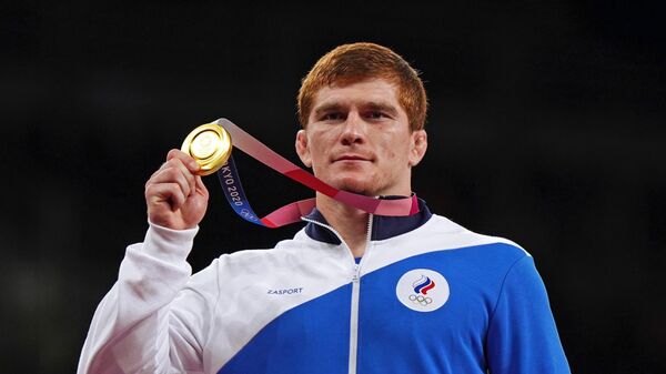  Муса Евлоев, завоевавший золотую медаль на соревнованиях по греко-римской борьбе среди мужчин в весовой категории до 97 кг на XXXII Олимпийских играх в Токио