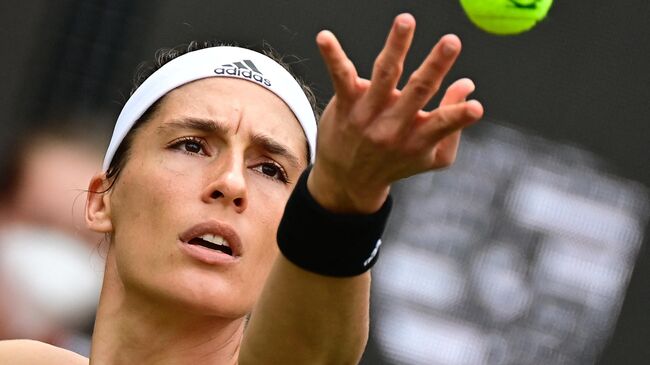 Germany's Andrea Petkovic serves a ball to Victoria Azarenka from Belarus during the women's Bett1 Open WTA 500 tennis tournament in Berlin on June 15, 2021. (Photo by Tobias Schwarz / AFP)