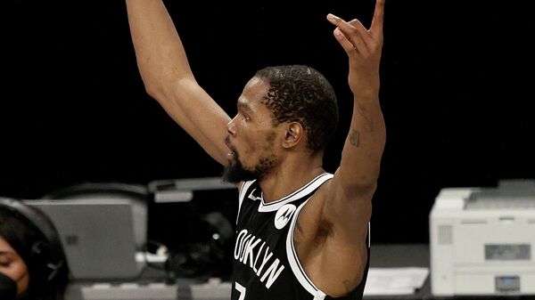 NEW YORK, NEW YORK - JUNE 19: Kevin Durant #7 of the Brooklyn Nets celebrates after he made a shot to tie the game and force overtime in the final seconds of the fourth quarter against the Milwaukee Bucks during game seven of the Eastern Conference second round at Barclays Center on June 19, 2021 in the Brooklyn borough of New York City. NOTE TO USER: User expressly acknowledges and agrees that, by downloading and or using this photograph, User is consenting to the terms and conditions of the Getty Images License Agreement.   Elsa/Getty Images/AFP (Photo by ELSA / GETTY IMAGES NORTH AMERICA / Getty Images via AFP)