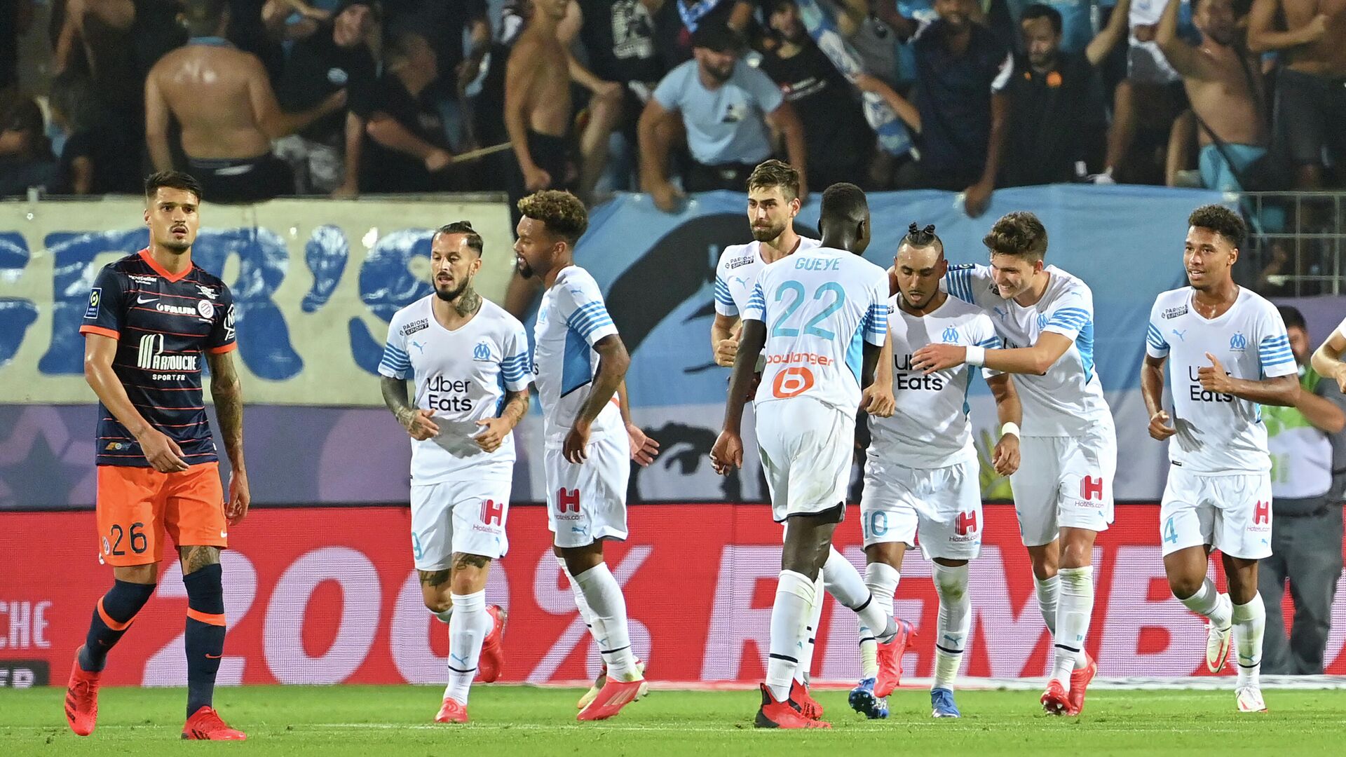 Marseille's players react after scoring a goal during the French L1 football match between Montpellier and Marseille at the Mosson stadium in Montpellier, southern France on August 8, 2021. (Photo by Pascal GUYOT / AFP) - РИА Новости, 1920, 09.08.2021