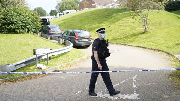 Сотрудник полиции на месте стрельбы в Плимуте, Великобритания 