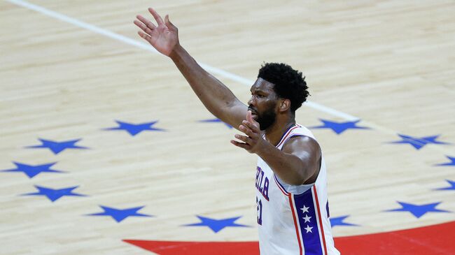 PHILADELPHIA, PENNSYLVANIA - JUNE 20: Joel Embiid #21 of the Philadelphia 76ers reacts during the first quarter against the Atlanta Hawks during Game Seven of the Eastern Conference Semifinals at Wells Fargo Center on June 20, 2021 in Philadelphia, Pennsylvania. NOTE TO USER: User expressly acknowledges and agrees that, by downloading and or using this photograph, User is consenting to the terms and conditions of the Getty Images License Agreement.   Tim Nwachukwu/Getty Images/AFP (Photo by Tim Nwachukwu / GETTY IMAGES NORTH AMERICA / Getty Images via AFP)