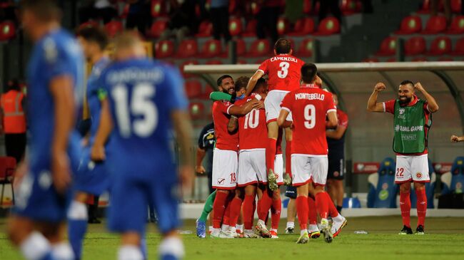 Soccer Football - World Cup - UEFA Qualifiers - Group H - Malta v Cyprus - National Stadium Ta'Qali, Attard, Malta - September 1, 2021  Malta's Cain Attard celebrates scoring their third goal with teammates REUTERS/Darrin Zammit Lupi