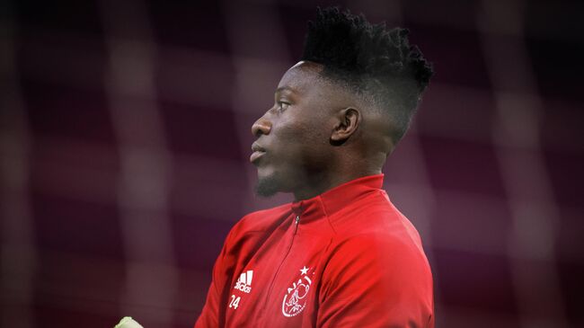 Ajax's Cameroonian goalkeeper Andre Onana looks on during the warm-up session prior to the UEFA Champions League Group D football match between Ajax and FC Midtjylland at the Johan Cruijff stadium, in Amsterdam, on November 25, 2020. (Photo by Kenzo Tribouillard / AFP)