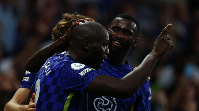 Chelsea's Belgian striker Romelu Lukaku celebrates scoring his team's third goal during the English Premier League football match between Chelsea and Aston Villa at Stamford Bridge in London on September 11, 2021. (Photo by Adrian DENNIS / AFP) / RESTRICTED TO EDITORIAL USE. No use with unauthorized audio, video, data, fixture lists, club/league logos or 'live' services. Online in-match use limited to 120 images. An additional 40 images may be used in extra time. No video emulation. Social media in-match use limited to 120 images. An additional 40 images may be used in extra time. No use in betting publications, games or single club/league/player publications. / 