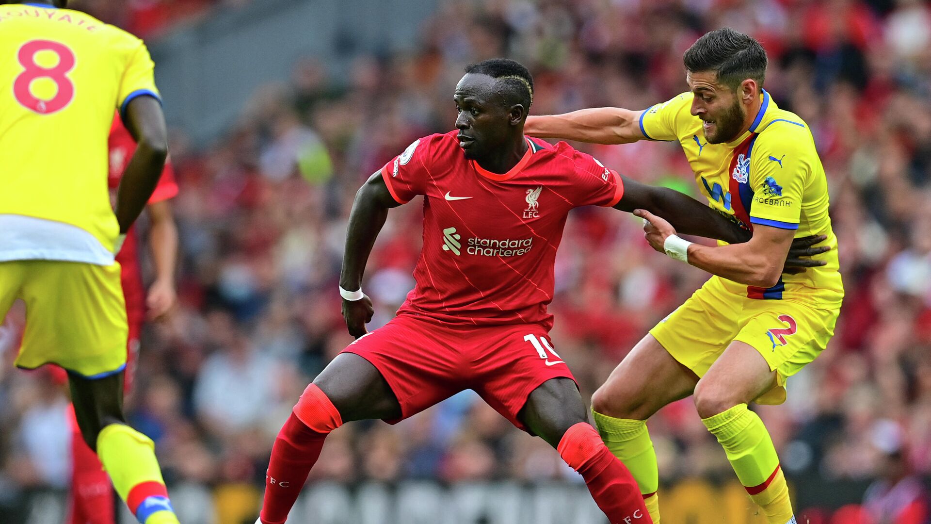 Liverpool's Senegalese striker Sadio Mane (C) vies with Crystal Palace's English defender Joel Ward (R) during the English Premier League football match between Liverpool and Crystal Palace at Anfield in Liverpool, north west England on September 18, 2021. (Photo by Paul ELLIS / AFP) / RESTRICTED TO EDITORIAL USE. No use with unauthorized audio, video, data, fixture lists, club/league logos or 'live' services. Online in-match use limited to 120 images. An additional 40 images may be used in extra time. No video emulation. Social media in-match use limited to 120 images. An additional 40 images may be used in extra time. No use in betting publications, games or single club/league/player publications. /  - РИА Новости, 1920, 18.09.2021