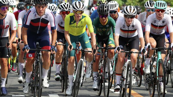 Russia's Tamara Dronova, Australia's Tiffany Cromwell and South Africa's Ashleigh Moolman-Pasio compete during the women's cycling road race at the Fuji International Speedway in Oyama, Japan, at the Tokyo 2020 Olympic Games on July 25, 2021. (Photo by Michael Steele / POOL / AFP)