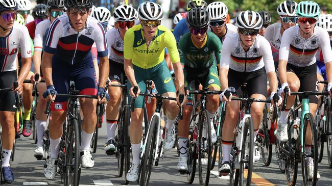 Russia's Tamara Dronova, Australia's Tiffany Cromwell and South Africa's Ashleigh Moolman-Pasio compete during the women's cycling road race at the Fuji International Speedway in Oyama, Japan, at the Tokyo 2020 Olympic Games on July 25, 2021. (Photo by Michael Steele / POOL / AFP)