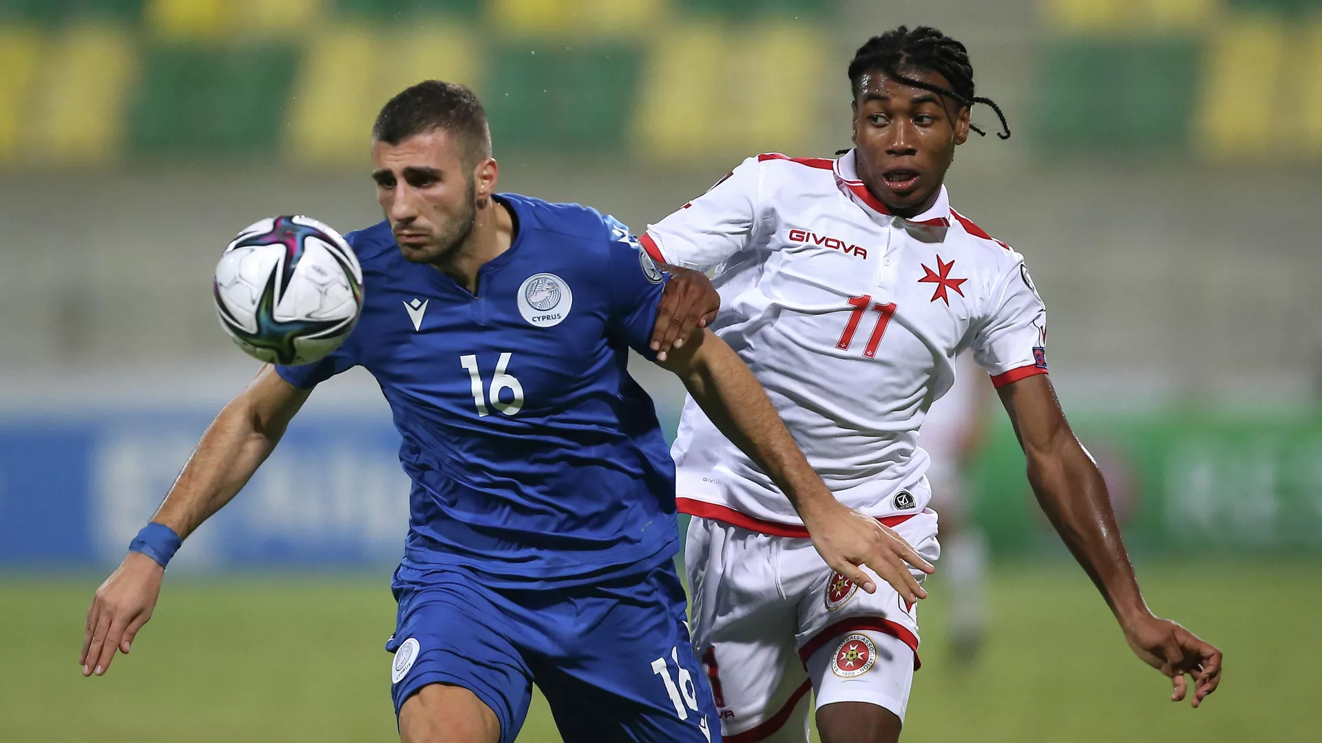 Soccer Football - World Cup - UEFA Qualifiers - Group H - Cyprus v Malta - AEK Arena - George Karapatakis, Larnaca, Cyprus - October 11, 2021 Cyprus' Costas Soteriou in action with Malta's Paul Mbong REUTERS/Yiannis Kourtoglou - РИА Новости, 1920, 11.10.2021