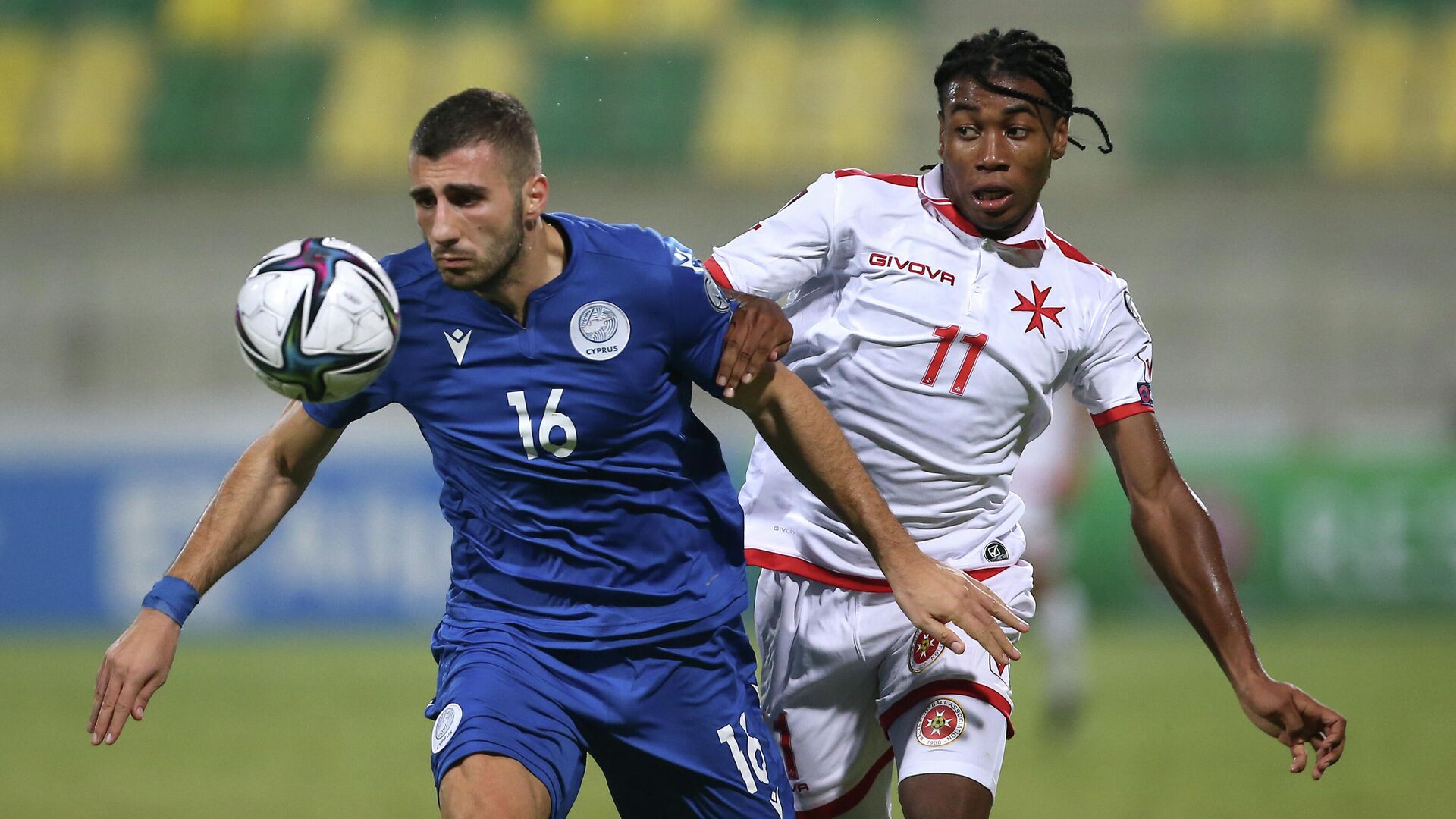 Soccer Football - World Cup - UEFA Qualifiers - Group H - Cyprus v Malta - AEK Arena - George Karapatakis, Larnaca, Cyprus - October 11, 2021 Cyprus' Costas Soteriou in action with Malta's Paul Mbong REUTERS/Yiannis Kourtoglou - РИА Новости, 1920, 11.10.2021