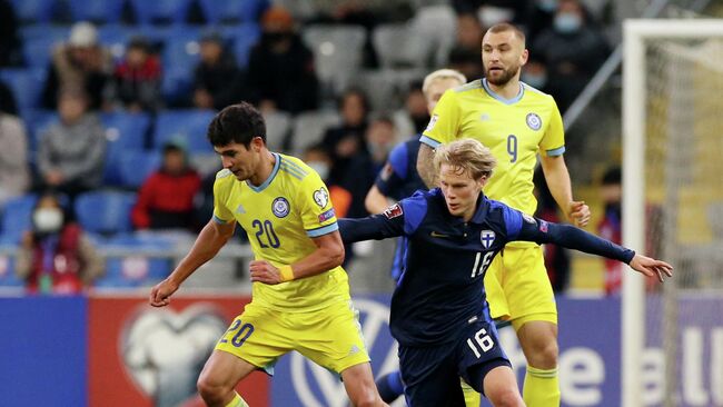 Soccer Football - World Cup - UEFA Qualifiers - Group D - Kazakhstan v Finland - Astana Arena, Astana, Kazakhstan - October 12, 2021 Finland's Urho Nissila in action with Kazakhstan's Marat Bystrov REUTERS/Pavel Mikheyev