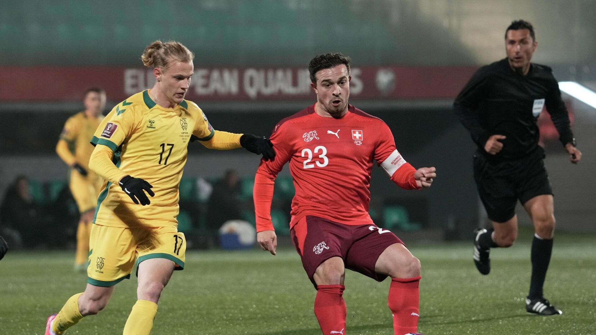 Soccer Football - World Cup - UEFA Qualifiers - Group C - Lithuania v Switzerland - LFF Stadium, Vilnius, Lithuania - October 12, 2021 Lithuania's Justas Lasickas in action with Switzerland's Xherdan Shaqiri REUTERS/Ints Kalnins - РИА Новости, 1920, 13.10.2021