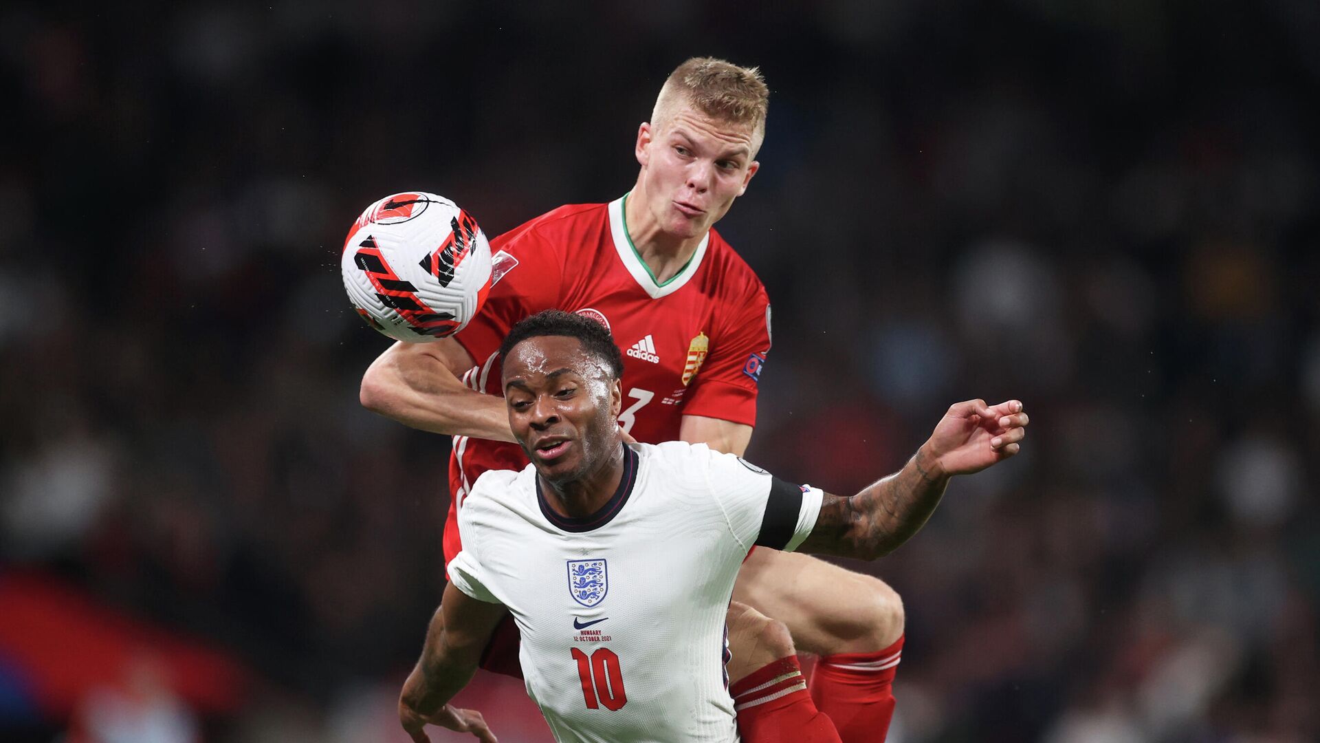 Soccer Football - World Cup - UEFA Qualifiers - Group I - England v Hungary - Wembley Stadium, London, Britain - October 12, 2021 Hungary's Andras Schafer in action with England's Raheem Sterling Action Images via Reuters/Carl Recine - РИА Новости, 1920, 13.10.2021