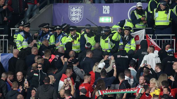 Soccer Football - World Cup - UEFA Qualifiers - Group I - England v Hungary - Wembley Stadium, London, Britain - October 12, 2021 General view as Police clash with Hungary fans during the match Action Images via Reuters/Carl Recine TPX IMAGES OF THE DAY Soccer Football - World Cup - UEFA Qualifiers - Group I - England v Hungary - Wembley Stadium, London, Britain - October 12, 2021 General view as Police clash with Hungary fans during the match Action Images via Reuters/Carl Recine TPX IMAGES OF THE DAY