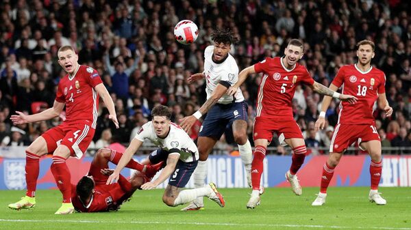 Soccer Football - World Cup - UEFA Qualifiers - Group I - England v Hungary - Wembley Stadium, London, Britain - October 12, 2021 Hungary's Attila Szalai in action with England's John Stones Action Images via Reuters/Carl Recine     TPX IMAGES OF THE DAY