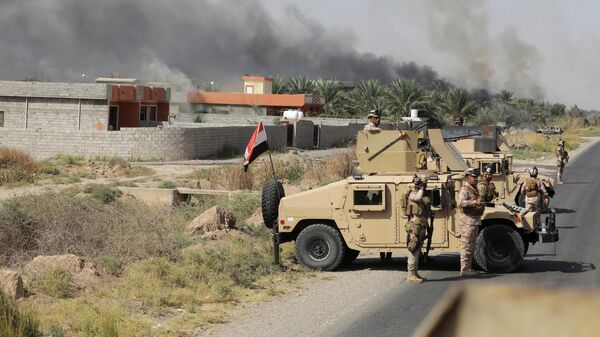Иракские военные после нападения боевиков ИГ* в районе Микдадия