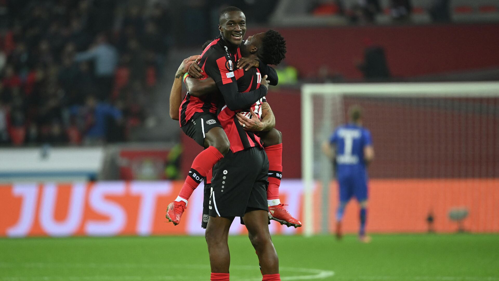 Leverkusen's French forward Moussa Diaby (Up) celebrates with Leverkusen's Burkinabe defender Edmond Tapsoba scoring the 2-0 during the UEFA Europa League Group G football match  Bayer 04 Leverkusen v Real Betis in Leverkusen, western Germany, on November 4, 2021. (Photo by Ina Fassbender / AFP) - РИА Новости, 1920, 05.11.2021
