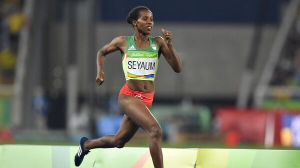 Ethiopia's Dawit Seyaum competes in the Women's 1500m Semifinal during the athletics event at the Rio 2016 Olympic Games at the Olympic Stadium in Rio de Janeiro on August 14, 2016. (Photo by Fabrice COFFRINI / AFP)