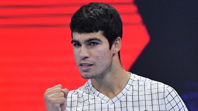 Spain's Carlos Alcaraz celebrates defeating Argentina's Sebastian Baez during their semi-final match of the Next Generation ATP Finals tournament on November 12, 2021 at the Allianz Cloud venue in Milan. (Photo by Tiziana FABI / AFP)