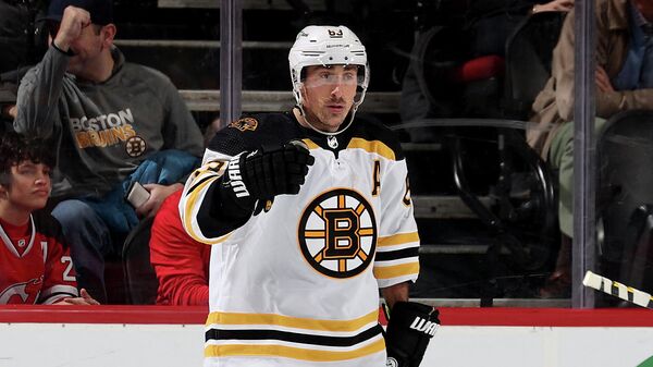 NEWARK, NEW JERSEY - NOVEMBER 13: Brad Marchand #63 of the Boston Bruins celebrates his goal in the second period against the New Jersey Devils at Prudential Center on November 13, 2021 in Newark, New Jersey.   Elsa/Getty Images/AFP (Photo by ELSA / GETTY IMAGES NORTH AMERICA / Getty Images via AFP)