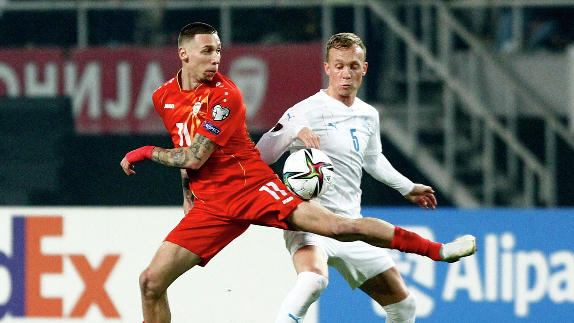 Soccer Football - World Cup - UEFA Qualifiers - Group J - North Macedonia v Iceland - Toshe Proeski Arena, Skopje, North Macedonia - November 14, 2021  North Macedonia's Darko Churlinov in action with Iceland's Gudmundur Thorarinsson REUTERS/Ognen Teofilovski - РИА Новости, 1920, 14.11.2021