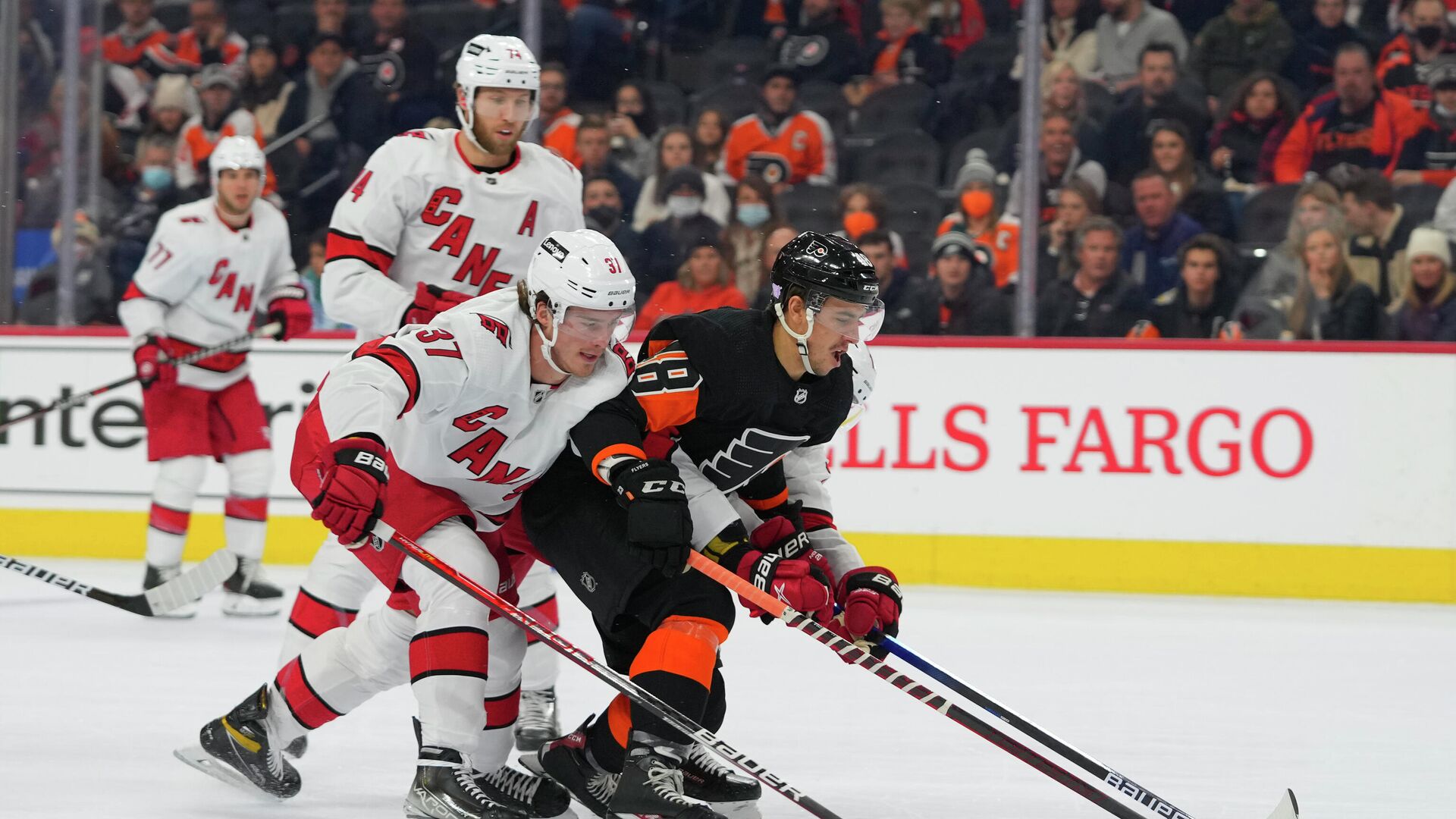 Nov 26, 2021; Philadelphia, Pennsylvania, USA; Philadelphia Flyers center Morgan Frost (48) battles for the puck with Carolina Hurricanes right wing Andrei Svechnikov (37) in the first period at the Wells Fargo Center. Mandatory Credit: Mitchell Leff-USA TODAY Sports - РИА Новости, 1920, 27.11.2021