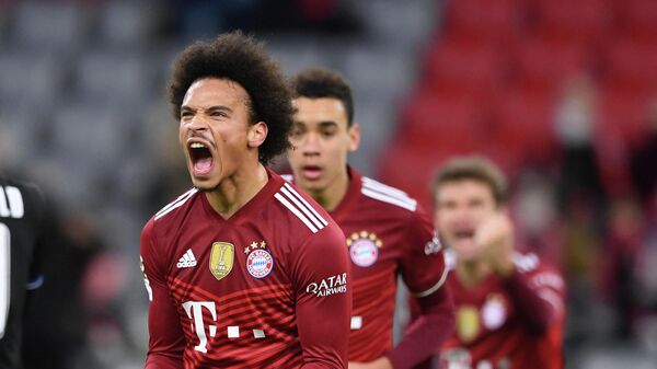 Bayern Munich's German midfielder Leroy Sane celebrates after the first goal during the German first division Bundesliga football match FC Bayern Munich v Arminia Bielefeld in Munich, southern Germany, on November 27, 2021. (Photo by Christof STACHE / AFP) / DFL REGULATIONS PROHIBIT ANY USE OF PHOTOGRAPHS AS IMAGE SEQUENCES AND/OR QUASI-VIDEO