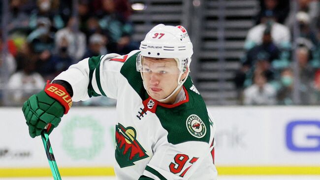 SEATTLE, WASHINGTON - NOVEMBER 13: Kirill Kaprizov #97 of the Minnesota Wild skates with the puck against the Seattle Kraken on November 13, 2021 at Climate Pledge Arena in Seattle, Washington.   Steph Chambers/Getty Images/AFP (Photo by Steph Chambers / GETTY IMAGES NORTH AMERICA / Getty Images via AFP)