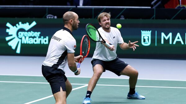 Tennis - Davis Cup Finals - Group F - Germany v Austria - Olympiahalle, Innsbruck, Austria - November 28, 2021  Germany's Kevin Krawietz and Tim Puetz in action during their doubles match against Austria's Oliver Marach and Philipp Oswald REUTERS/Leonhard Foeger