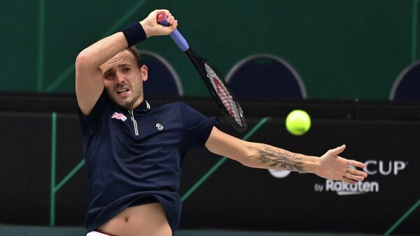 Britain's Daniel Evans returns the ball to Germany's Peter Gojowczyk (not in picture) during the men's singles quarter-final tennis match between Britain and Germany at the Davis Cup tennis tournament in Innsbruck, Austria, on November 30, 2021. (Photo by JOE KLAMAR / AFP)