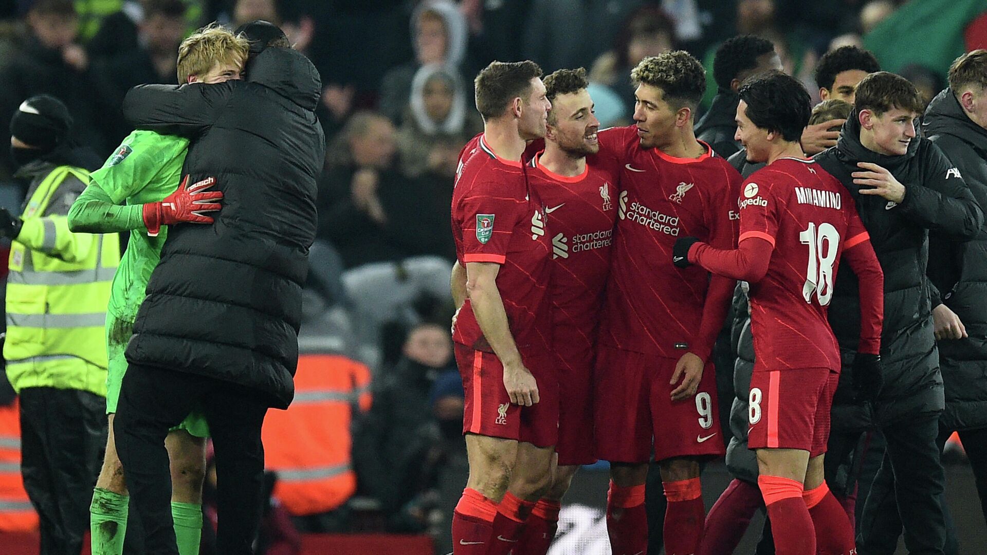 Liverpool's players celebrate on the pitch after the English League Cup quarter-final football match between Liverpool and Leicester City at Anfield in Liverpool, north west England on December 22, 2021. - Liverpool won the game on penalties after the game finished 3-3. (Photo by Oli SCARFF / AFP) / RESTRICTED TO EDITORIAL USE. No use with unauthorized audio, video, data, fixture lists, club/league logos or 'live' services. Online in-match use limited to 120 images. An additional 40 images may be used in extra time. No video emulation. Social media in-match use limited to 120 images. An additional 40 images may be used in extra time. No use in betting publications, games or single club/league/player publications. /  - РИА Новости, 1920, 23.12.2021