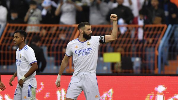 Real Madrid's French forward Karim Benzema celebrates after scoring a penalty during the Spanish Super Cup final football match between Athletic Bilbao and Real Madrid on January 16, 2022, at the King Fahd International stadium in the Saudi capital of Riyadh. (Photo by AFP)