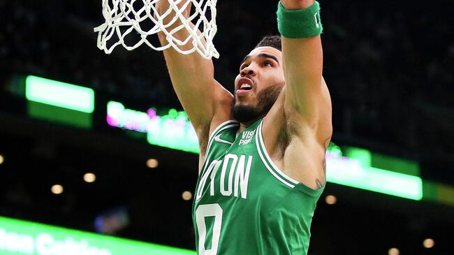 BOSTON, MA - JANUARY 19: Jayson Tatum #0 of the Boston Celtics dunks the ball during a game aghast the Charlotte Hornets at TD Garden on January 19, 2022 in Boston, Massachusetts. NOTE TO USER: User expressly acknowledges and agrees that, by downloading and or using this photograph, User is consenting to the terms and conditions of the Getty Images License Agreement.   Adam Glanzman/Getty Images/AFP (Photo by Adam Glanzman / GETTY IMAGES NORTH AMERICA / Getty Images via AFP)