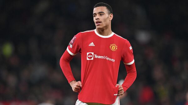 Manchester United's English striker Mason Greenwood geatures during the English FA Cup third round football match between Manchester United and Aston Villa at Old Trafford in Manchester, north-west England, on January 10, 2022. (Photo by Paul ELLIS / AFP) / RESTRICTED TO EDITORIAL USE. No use with unauthorized audio, video, data, fixture lists, club/league logos or 'live' services. Online in-match use limited to 120 images. An additional 40 images may be used in extra time. No video emulation. Social media in-match use limited to 120 images. An additional 40 images may be used in extra time. No use in betting publications, games or single club/league/player publications. / 