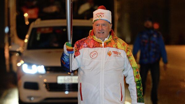 Член комитета Государственной Думы РФ по обороне, руководитель фракции ЛДПР Владимир Жириновский во время эстафеты Олимпийского огня в Москве. 2013 год