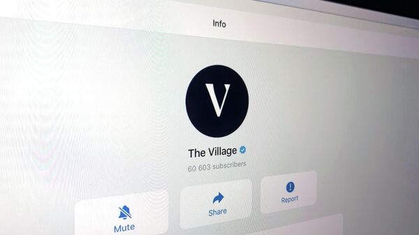 Telegram-канал издания The Village на экране ноутбука