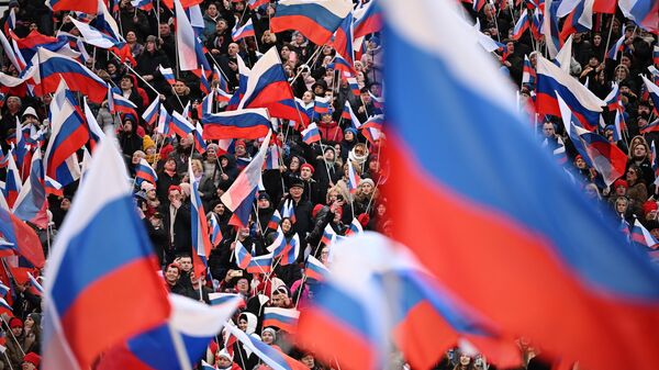 Участники митинга-концерта в Лужниках, посвященного воссоединению Крыма с Россией