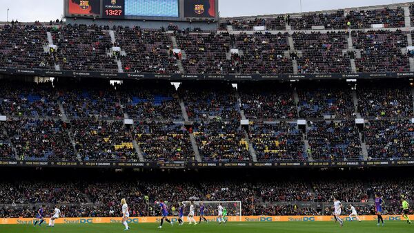 Players take part in the the women's UEFA Champions League quarter final second leg football match between FC Barcelona and Real Madrid CF at the Camp Nou stadium in Barcelona on March 30, 2022. (Photo by Josep LAGO / AFP)