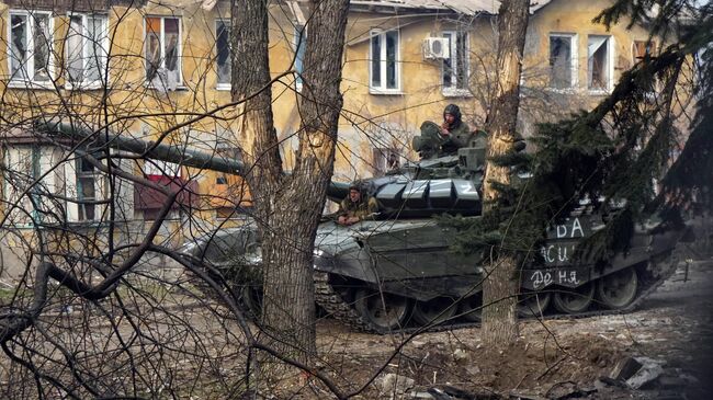 Военнослужащие НМ ДНР во время боестолкновений в Левобережном районе Мариуполя