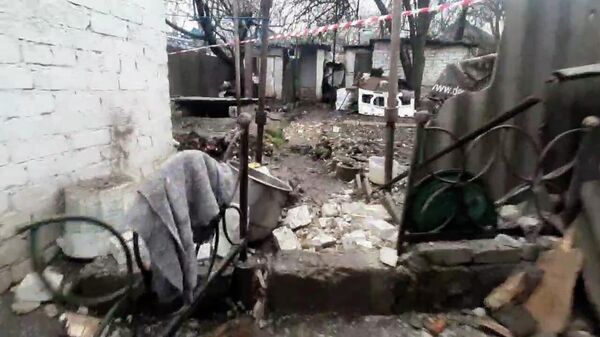 Последствия удара украинских боевиков по Донецку РСЗО Ураган