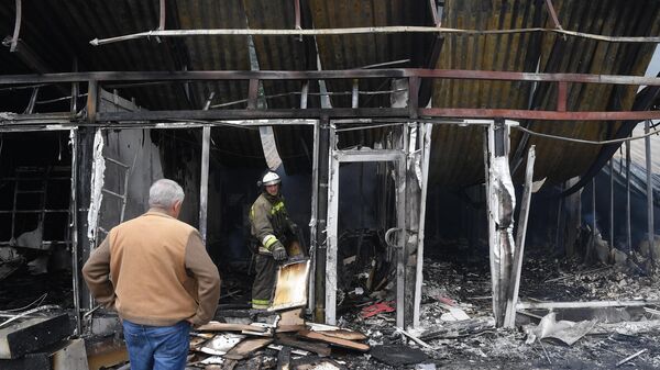 Рынок Текстильщик в Донецке, сгоревший после обстрела со стороны ВСУ