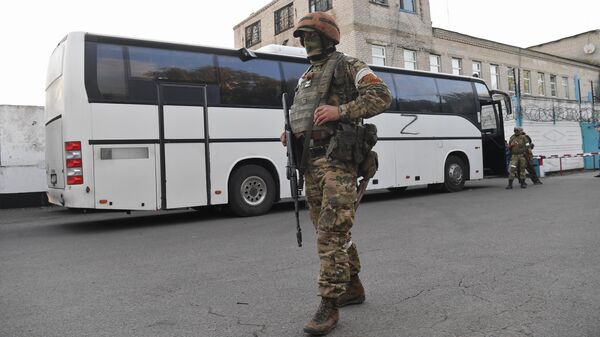 A bus with surrendered Ukrainian soldiers and militants of the Azov nationalist battalion near the pre-trial detention center in Yelenovka