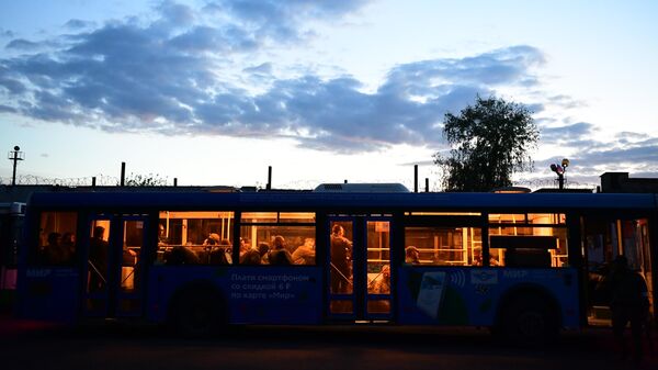A bus with surrendered Ukrainian soldiers and militants of the Azov nationalist battalion near the pre-trial detention center in Yelenovka