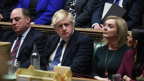 Министр обороны Великобритании Бен Уоллес, премьер-министр Великобритании Борис Джонсон и министр иностранных дел Великобритании Лиз Трасс на заседании по ситуации на Украине. 24 февраля 2022