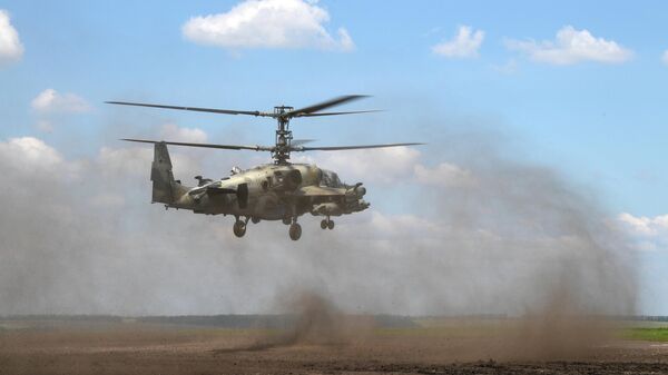 Ударный вертолет Ка-52 ВКС России над аэродромом базирования в зоне проведения специальной военной операции на Украине